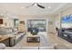 Spacious living room boasts tile floors, neutral tones, and seamless access to the outdoor area at 4714 Seneca Park Trl, Bradenton, FL 34211