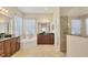 Relaxing main bathroom featuring dual vanities, a soaking tub, and a separate shower at 4714 Seneca Park Trl, Bradenton, FL 34211