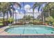 Sparkling pool with a screened enclosure with views of lake at 4714 Seneca Park Trl, Bradenton, FL 34211