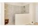 Modern shower with neutral tile at 4714 Seneca Park Trl, Bradenton, FL 34211