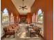 Inviting covered patio with comfortable seating and beautiful architectural details at 5179 Cantabria Crst, Sarasota, FL 34238