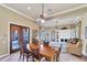 Inviting dining area with ceiling fans, and views of the community pool at 5179 Cantabria Crst, Sarasota, FL 34238