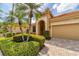 Charming single-story home featuring manicured landscaping and a neutral color palette at 5179 Cantabria Crst, Sarasota, FL 34238