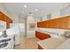 Bright, well-lit kitchen offers ample counter space and modern appliances for cooking and entertaining at 5179 Cantabria Crst, Sarasota, FL 34238