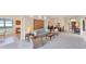 Spacious living room with comfortable seating, dining area, and ample natural light creating an inviting and open space at 5179 Cantabria Crst, Sarasota, FL 34238