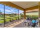 Screened patio with lake view offering comfortable seating to relax and enjoy the tranquil scenery at 5179 Cantabria Crst, Sarasota, FL 34238