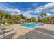 Community swimming pool with plenty of seating and lounging options at 5179 Cantabria Crst, Sarasota, FL 34238