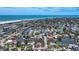 Aerial view showcases property's prime location, nestled among tree-lined streets and convenient beach access and waterways at 5572 Shadow Lawn Dr, Sarasota, FL 34242