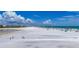 Expansive view of Siesta Beach, a popular tourist destination with clear blue waters and white sandy shores at 5572 Shadow Lawn Dr, Sarasota, FL 34242