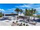 Modern Siesta Beach amenities include a stylish building with large windows, picnic tables, and a covered market area at 5572 Shadow Lawn Dr, Sarasota, FL 34242