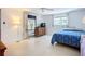 Bedroom with an open patio and a view of the lush outdoor area at 5572 Shadow Lawn Dr, Sarasota, FL 34242