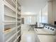 Bright laundry room with built-in shelving and modern appliances, offering convenience and organization at 5572 Shadow Lawn Dr, Sarasota, FL 34242