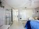 Spacious primary bedroom features large closet, ensuite bathroom, and lots of storage at 5572 Shadow Lawn Dr, Sarasota, FL 34242