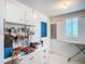 Organized workshop area with ample storage, workbench, and tool display for hobbies and projects at 5572 Shadow Lawn Dr, Sarasota, FL 34242