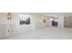 Bright living room with windows and an adjoining bathroom at 564 Spanish N Dr, Longboat Key, FL 34228