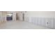 Home renovation with plaster walls leading to the kitchen, entryway, and a bright sunroom at 564 Spanish N Dr, Longboat Key, FL 34228
