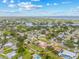 Expansive aerial view showcases the single-Gathering home, surrounded by mature trees and a tranquil neighborhood at 6103 6Th Nw Ave, Bradenton, FL 34209