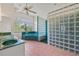 Bathroom featuring a glass block shower, large garden tub, and granite counters at 6103 6Th Nw Ave, Bradenton, FL 34209