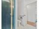 Bathroom featuring a glass enclosed shower, white toilet and wood-look flooring at 6103 6Th Nw Ave, Bradenton, FL 34209