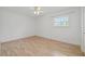 Bedroom with ceiling fan, wood-look flooring, one window and white walls at 6103 6Th Nw Ave, Bradenton, FL 34209