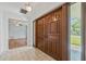 Foyer with double doors and tiled floor, with view into a spacious living area with wood floors at 6103 6Th Nw Ave, Bradenton, FL 34209