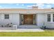 Inviting entrance with a large, dark wood double door and sidelight windows for added natural light at 6103 6Th Nw Ave, Bradenton, FL 34209