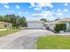 Two-car detached garage with a spacious driveway offers ample parking and storage for this single-Gathering home at 6103 6Th Nw Ave, Bradenton, FL 34209