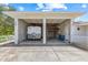 Exterior view of a two-car garage, high ceilings, and an RV at 6103 6Th Nw Ave, Bradenton, FL 34209