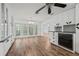 Well-lit kitchen with wood floors, lots of storage, modern appliances, and access to other rooms at 6103 6Th Nw Ave, Bradenton, FL 34209