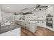 A well-equipped kitchen with a center island, stainless steel appliances, and ample counter space at 6103 6Th Nw Ave, Bradenton, FL 34209