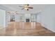 Expansive living area featuring hardwood floors, a cozy fireplace, and access to the outdoors through French doors at 6103 6Th Nw Ave, Bradenton, FL 34209