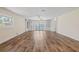 Bright living room with built-in shelving and French doors, offering a view of the outside and abundant light at 6103 6Th Nw Ave, Bradenton, FL 34209