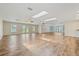 Bright, expansive living room with skylights and multiple French doors, offering a great view of the property at 6103 6Th Nw Ave, Bradenton, FL 34209