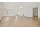 Living room with multiple windows, ceiling fans and wood-look flooring at 6103 6Th Nw Ave, Bradenton, FL 34209