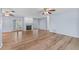 Spacious living room with hardwood floors, a fireplace, and French doors leading to the backyard at 6103 6Th Nw Ave, Bradenton, FL 34209