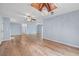 Open-concept living area boasts hardwood floors and a chandelier, with connections to other rooms at 6103 6Th Nw Ave, Bradenton, FL 34209
