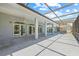 Spacious covered patio with ceiling fans and views of the pool and backyard at 6103 6Th Nw Ave, Bradenton, FL 34209