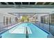 Enclosed pool with clear water and a view through the screened enclosure at 6103 6Th Nw Ave, Bradenton, FL 34209