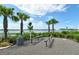 Community outdoor fitness area overlooking the lake with lush landscaping and exercise equipment at 6204 Isla Del Ray Ave, Sarasota, FL 34240