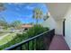 View of a car portico with landscaped grounds, offering a serene view from a private outdoor balcony at 6472 Seagull Dr # 301, Bradenton, FL 34210