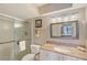 Bathroom with shower, granite vanity, a mirror and towel rack providing a clean, refreshing space at 6472 Seagull Dr # 301, Bradenton, FL 34210
