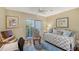 Bedroom with a comfortable bed, bright window, desk setup, providing a cozy and functional living space at 6472 Seagull Dr # 301, Bradenton, FL 34210