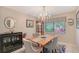 Dining room with chandelier, wood table, and updated furnishings at 6472 Seagull Dr # 301, Bradenton, FL 34210