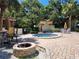 Community hot tub with a fire pit providing a relaxing space for residents to unwind and enjoy the outdoors at 6472 Seagull Dr # 301, Bradenton, FL 34210