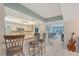 Open-concept kitchen with a breakfast bar, recessed lighting, and tile floors at 6472 Seagull Dr # 301, Bradenton, FL 34210