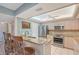 Bright kitchen featuring stainless steel appliances, granite countertops, and breakfast bar seating at 6472 Seagull Dr # 301, Bradenton, FL 34210