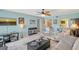 Bright and spacious living room with an open layout, tile flooring, and comfortable seating arrangements at 6472 Seagull Dr # 301, Bradenton, FL 34210