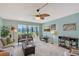 Cozy living room with tile floors, modern furniture, and a large window offering scenic views at 6472 Seagull Dr # 301, Bradenton, FL 34210