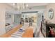 Open concept living space with view of the kitchen and a chandelier at 6472 Seagull Dr # 301, Bradenton, FL 34210