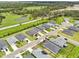 A high-angle showcases a tranquil residential neighborhood with orderly streets, neat homes, and surrounding greenery at 6528 166Th E Pl, Parrish, FL 34219